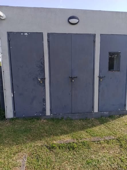 Restored external utility access doors protecting plumbing connections