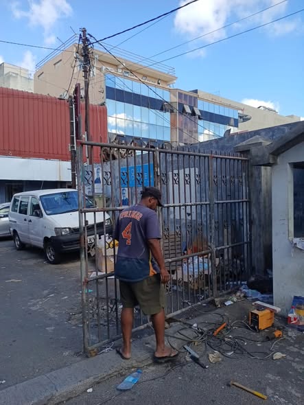 Rusted metal gates repaired and rehung at a commercial premises in Rose Hill