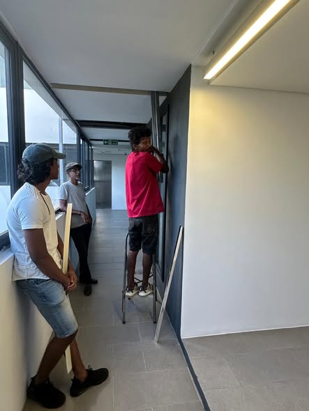 Technicians retrofitting LED tubes and bypassing ballasts in Mauritius
